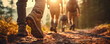 Hikers walking in fores in sunset light. Detail on hiker shoe rear view.  copy space for text.