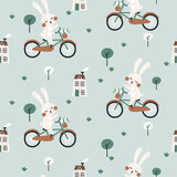 Fototapeta Dinusie - Seamless pattern with cute rabbit on bicycle. Vector