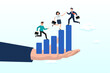 © Art of Ngu - Business people help each other walk up growth graph on HR hand, employee development, talent management or career growth, staff engagement or teamwork and support for success, improvement (Vector)