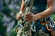 climber securing rope through a rappel ring on a harness