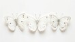 An isolated white background shows three white butterflies