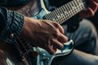 overshoulder view of guitarist, focusing on fretting hand