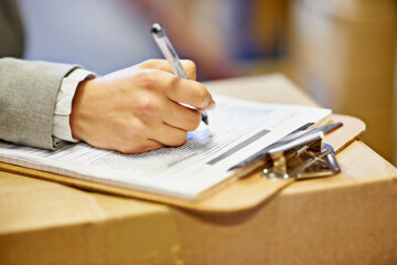 Canvas Print - Inspector, clipboard and closeup of hand writing in warehouse for inventory, quality control and freight distribution. Logistics, person and wholesale supplier with stock checklist for box inspection