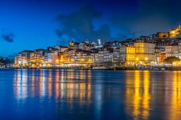 Wall Mural - Night skyline of Porto, Portugal, on the banks of the Douro River, cityscape at night.