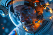 Astronaut man in a space suit with a helmet on his head. The helmet is illuminated with a bright orange light