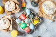 Easter egg and cake on grey concrete table. Happy easter backdrop for spring holiday. top view