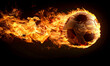 Fast kicked soccer ball burning and flying at excessive speed, black background.