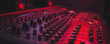 Wide-angle shot of a mixing console for a recording studio. Red cinematic studio light