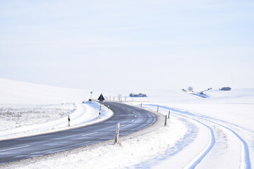 Wall Mural - country road in snow covered land