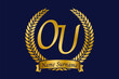Initial letter O and U, OU monogram logo design with laurel wreath. Luxury golden calligraphy font.