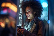 Close-up portrait of a woman hold mobile phone in a nightclub, bathed in colorful lights neon.social network concept.