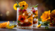 A refreshing herbal iced tea cocktail with edible flowers and crushed ice in a glass jar