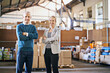 © peopleimages.com - Boxes, portrait and business people in factory together with package, logistics or distribution. Export, commerce and service delivery team at cargo storage warehouse with confidence, pride and smile