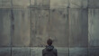 Conceptual image portraying the feeling of boredom with a person staring blankly at a wall in a mundane environment