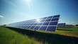 Solar energy panels in a green field with blue sky and sun