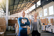 © peopleimages.com - Confidence, portrait and business people in factory together with package, logistics and distribution. Export, commerce and service team at cargo storage warehouse with clipboard, pride and smile