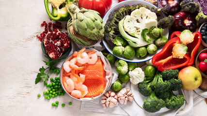 Canvas Print - Vegetables, fish, berry on wooden background. Healthy food concept