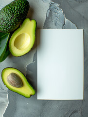 Sticker - Avocado with seed and copy space on textured grey background.