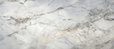 Fototapeta Desenie - A detailed view of a white marble surface with intricate veins and patterns. The high-resolution image showcases the design and texture of the Italian matt marble, perfect for ceramic wall and floor