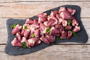 Poster - Raw chicken giblets hearts , meat background