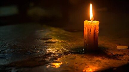 Wall Mural - a lit candle sitting on top of a table