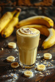 Fototapeta Do pokoju - Healthy banana smoothie milkshake in glass with bananas on table 
