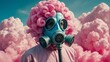 Man in gas mask with pink, cotton candy hair, pink cloud in the background