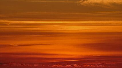 Wall Mural - The warm and gentle light of a summer sunset clouds creates a peaceful atmosphere.