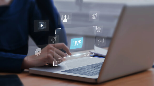 Businesswoman watching live stream video on computer laptop, learning online internet live broadcast communication technology.