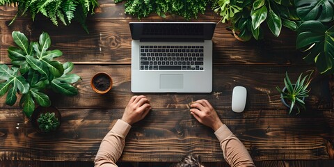 Poster - a serene and focused workspace with a laptop placed on a wooden desk amidst a lush