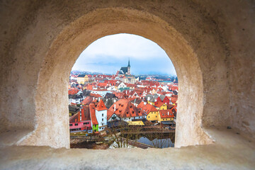 Wall Mural - Town of Cesky Krumlov and Vltava river panoramic view through stone window