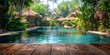 Tranquil resort pool surrounded by natural greenery under a sunny sky