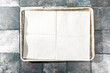 © Bidwell Studio - Overhead of folded parchment paper on tray