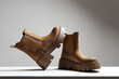 brown suede boots. fashion female shoes still life