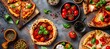 Various kinds of pizza with tomatoes, basil, and cheese on a dark background.