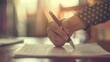 Business process, hand holding a pen, ready to sign a contract, on a blurred office background