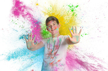 Wall Mural - Holi festival celebration. Happy teen boy covered with colorful powder dyes on white background