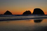 Fototapeta Sawanna - Sunset behind the sea stacks on the Oregon coast