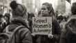 Woman Holding Sign: Respect Womens Authority
