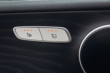 Car seats heating control panel buttons close up