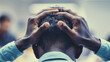 Office Stress
 Close-up of an African American man in an office setting, visibly distressed with hands on head, portraying stress and anxiety amidst work pressure.