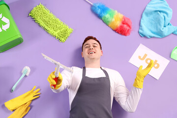 Sticker - Male janitor with cleaning supplies and word JOB on lilac background, top view