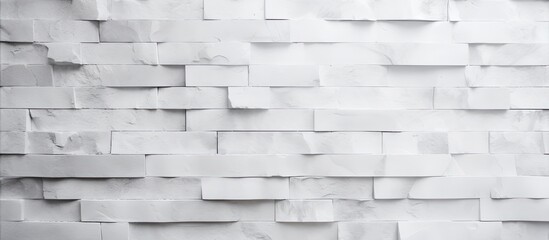Poster - A close up of a white brick wall with a geometric pattern featuring brown, grey rectangles. The brickwork showcases symmetry and serves as building material or flooring