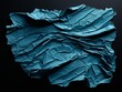 torn azure papper on a black background 