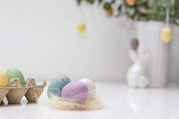 Wall Mural - Colorful easter eggs decoration on white table