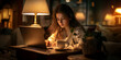 © Dorian Clover - A young woman deeply focused on her work in front of a laptop at night. The soft glow of the table lamp illuminates her thoughtful expression.