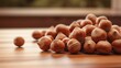 Image of hazelnuts on a wood table.