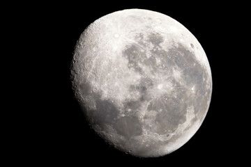 Wall Mural - the moon is 17 days old and is in the waning gibbous phase of its lunar cycle. it is 95% illuminated