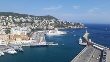 View Of The Port Of Nice Baie Des Anges , Colorful Houses In The City Of Nice On The French Riviera In South East Of France With A Lot Of Boats In The Harbour.