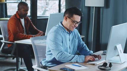 Aufkleber - Man Working on Laptop at Desk